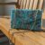 7a8629ca-ee15-4f29-adbb-e034ef0a6fd5 Blue Sunray Luxe Beaded Clutch