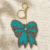 pomelli_photoshoot_image_9_16_0630 (23) Turquoise Bow Beaded Keychain