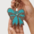 pomelli_photoshoot_image_9_16_0630 (24) Turquoise Bow Beaded Keychain