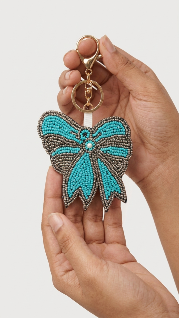 pomelli_photoshoot_image_9_16_0630 (24) Turquoise Bow Beaded Keychain