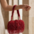 pomelli_photoshoot_image_9_16_0704 (3) Ruby Fringe Glam Handbag
