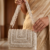 pomelli_photoshoot_image_9_16_0704 (4) Ivory Crystal Cascade Handbag