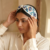 pomelli_photoshoot_image_9_16_0715(4) Azure Pearl Bloom Bow Hairband
