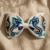 pomelli_photoshoot_image_9_16_0715(6) Azure Pearl Bloom Bow Hairband